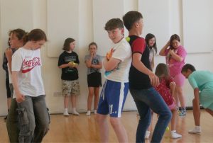 Children taking part in a drama and movement game during Little Red Kettle summer camp in Waterford.