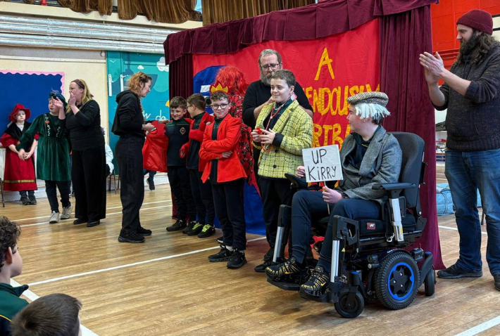 Children participating in Little Red Kettle’s Interactive Touring Play in a primary school hall.