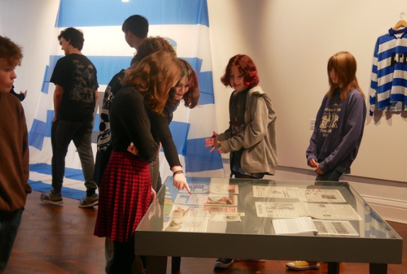 Children and young people exploring artwork during a Culture Club creative workshop at Little Red Kettle.